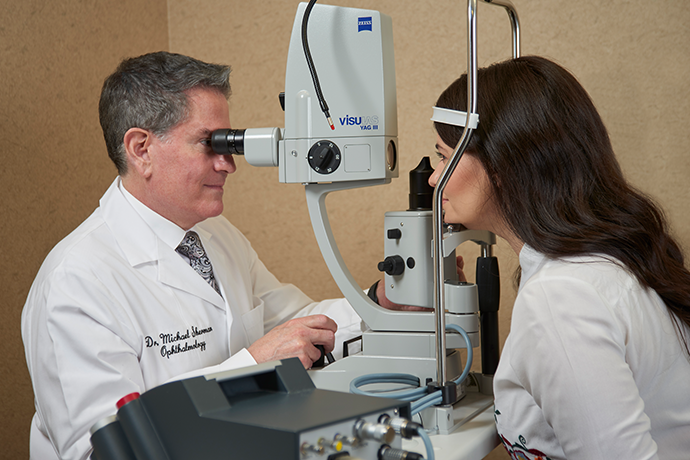Dr. Sherman examining patient's eyes